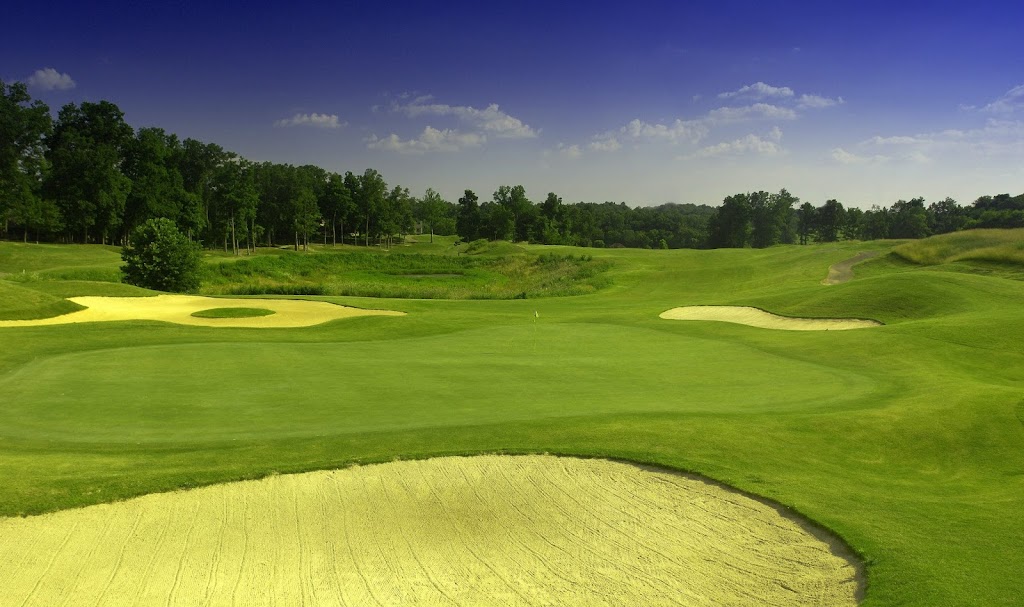 Panoramic view of a lush green golf course at The Legacy Golf Course. Smooth