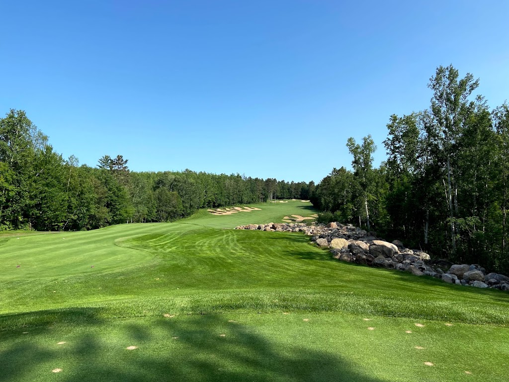 Panoramic view of a lush green golf course at The Legend at Giants Ridge. Smooth