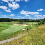 Panoramic view of a lush green golf course at The Links at Gettysburg. Smooth