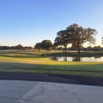 Panoramic view of a lush green golf course at The Links at Pine Hill. Smooth