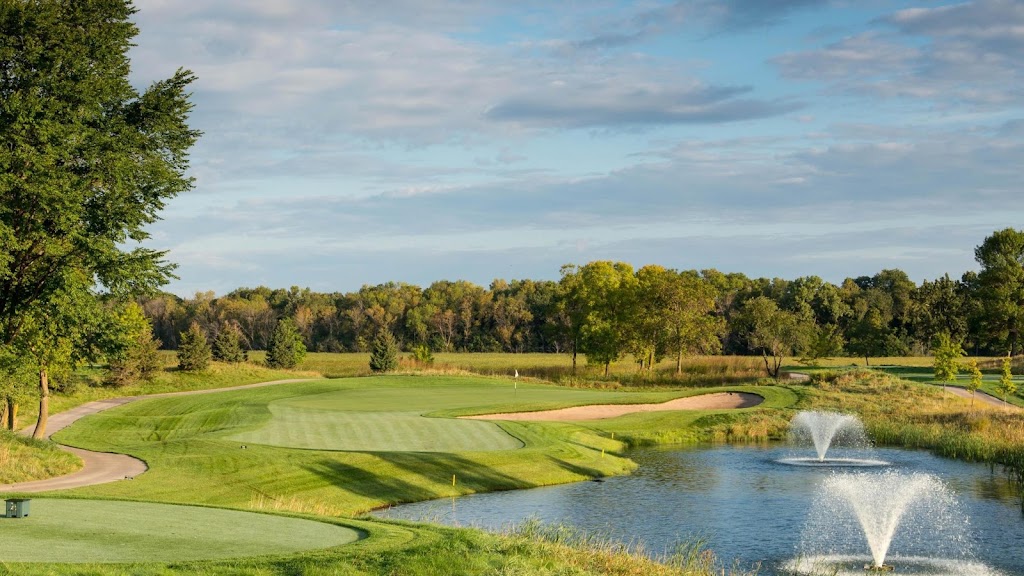 Panoramic view of a lush green golf course at The Meadows at Mystic Lake. Smooth