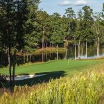 Panoramic view of a lush green golf course at The National Course at Reynolds Lake Oconee. Smooth