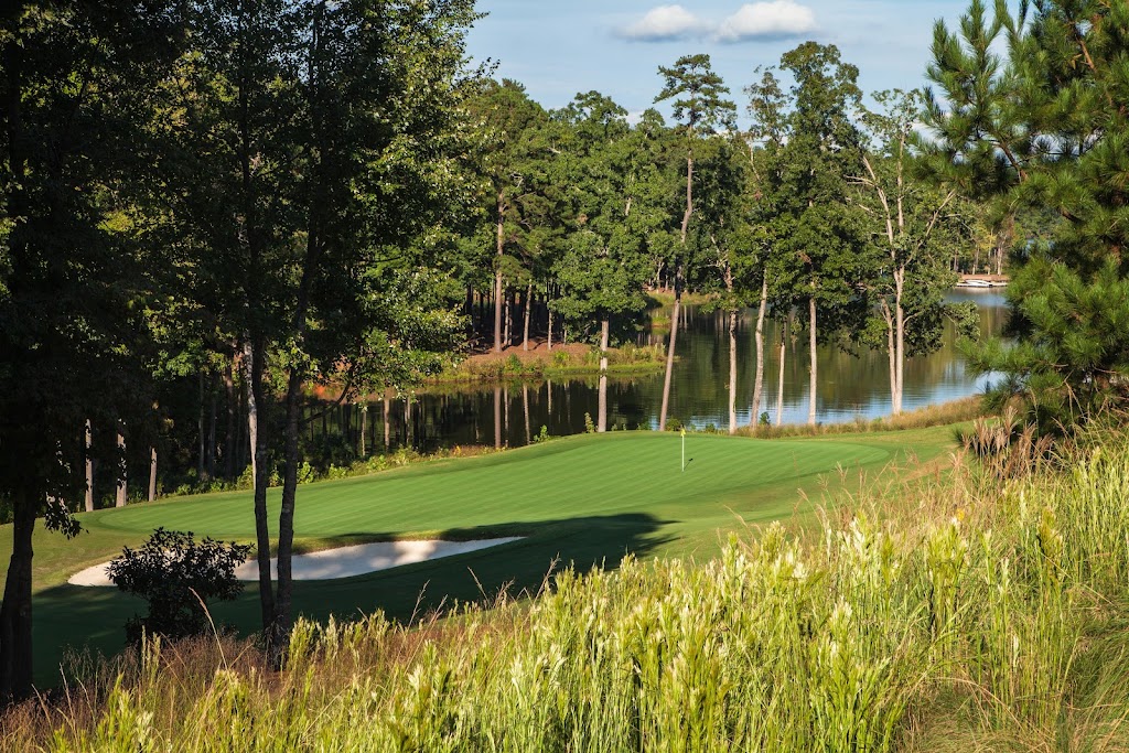 Panoramic view of a lush green golf course at The National Course at Reynolds Lake Oconee. Smooth