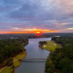 Panoramic view of a lush green golf course at The Oconee Course at Reynolds Lake Oconee. Smooth