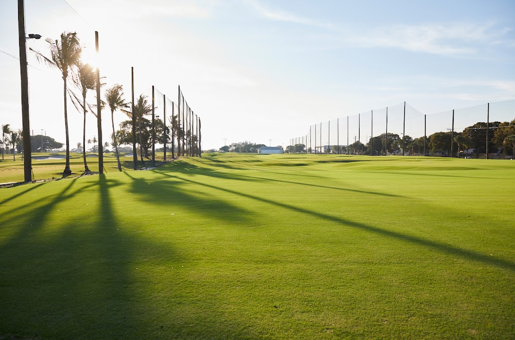 Panoramic view of a lush green golf course at The Park West Palm. Smooth