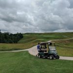 green grass with the flag in the hole.