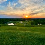 Panoramic view of a lush green golf course at The Pete Dye Course at French Lick. Smooth