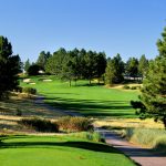 Panoramic view of a lush green golf course at The Pinery Country Club. Smooth