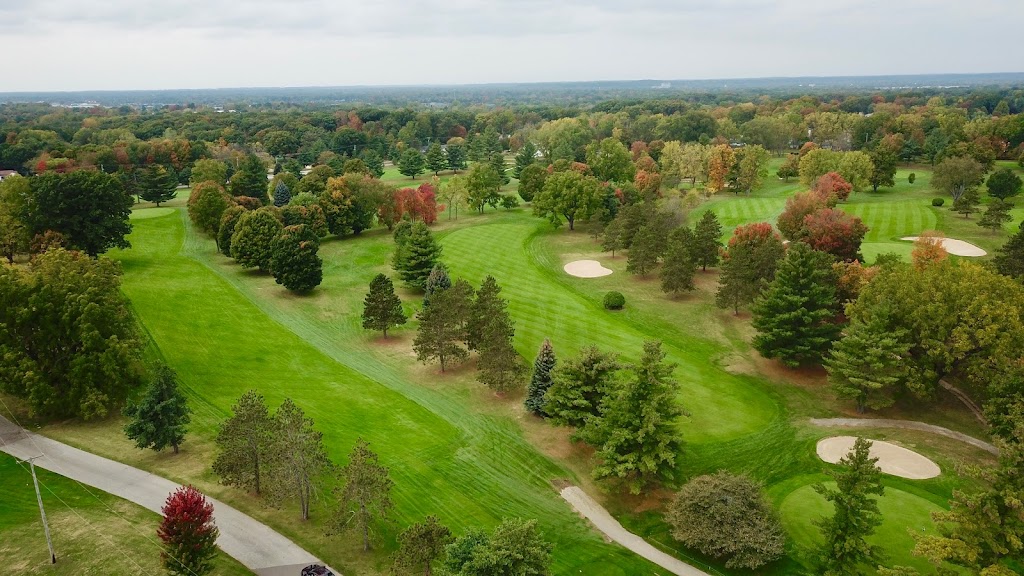 Panoramic view of a lush green golf course at The Pines Golf Course. Smooth