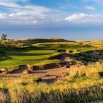 Panoramic view of a lush green golf course at The Prairie Club. Smooth