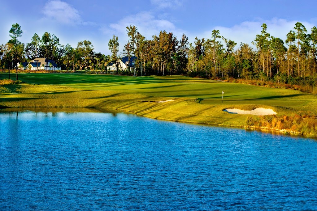 Panoramic view of a lush green golf course at The Preserve Golf Club. Smooth