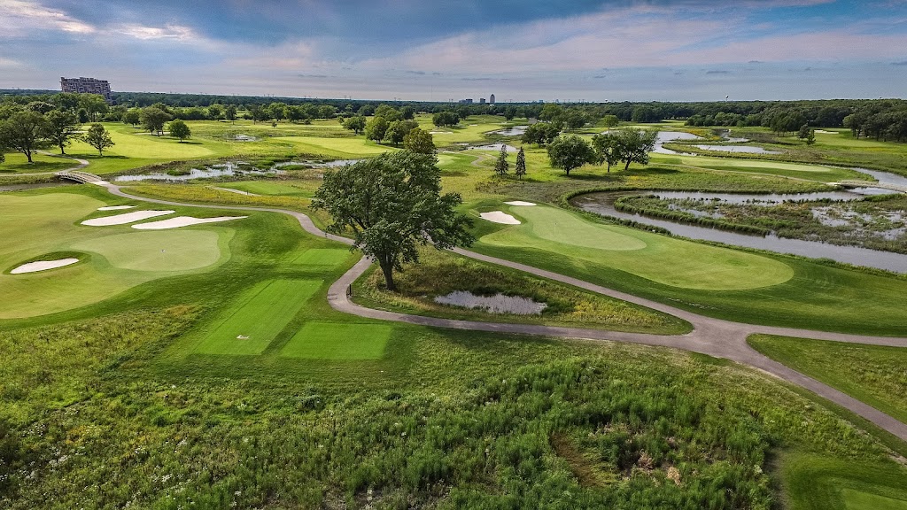 Panoramic view of a lush green golf course at The Preserve at Oak Meadows. Smooth