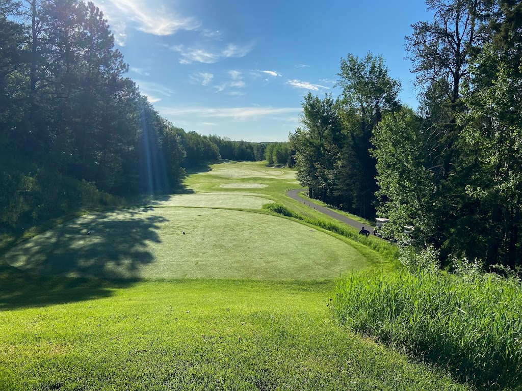 Panoramic view of a lush green golf course at The Quarry at Giants Ridge. Smooth