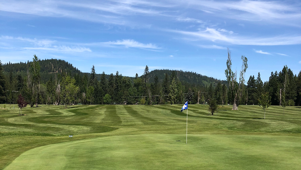 Panoramic view of a lush green golf course at The Ranch Club. Smooth