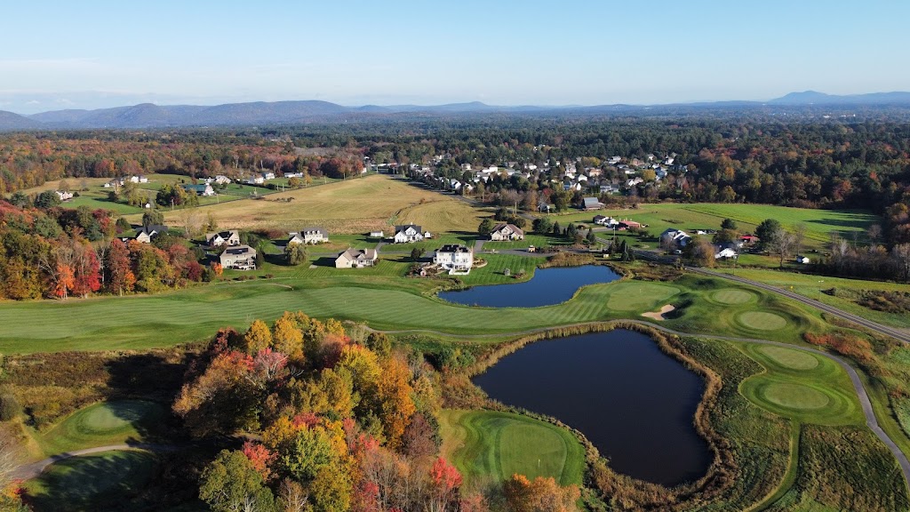 Panoramic view of a lush green golf course at The Ranch Golf Club. Smooth