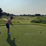 green grass with the flag in the hole.