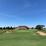 Panoramic view of a lush green golf course at The Rawls Course. Smooth