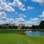 Panoramic view of a lush green golf course at The Reserve Club At Woodside. Smooth