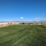 Panoramic view of a lush green golf course at The Ridge Golf Club. Smooth