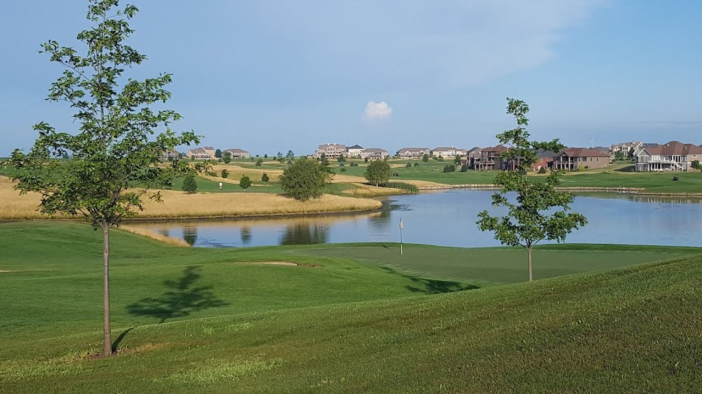Panoramic view of a lush green golf course at The Ridge Golf Club. Smooth