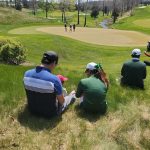 green grass with the flag in the hole.