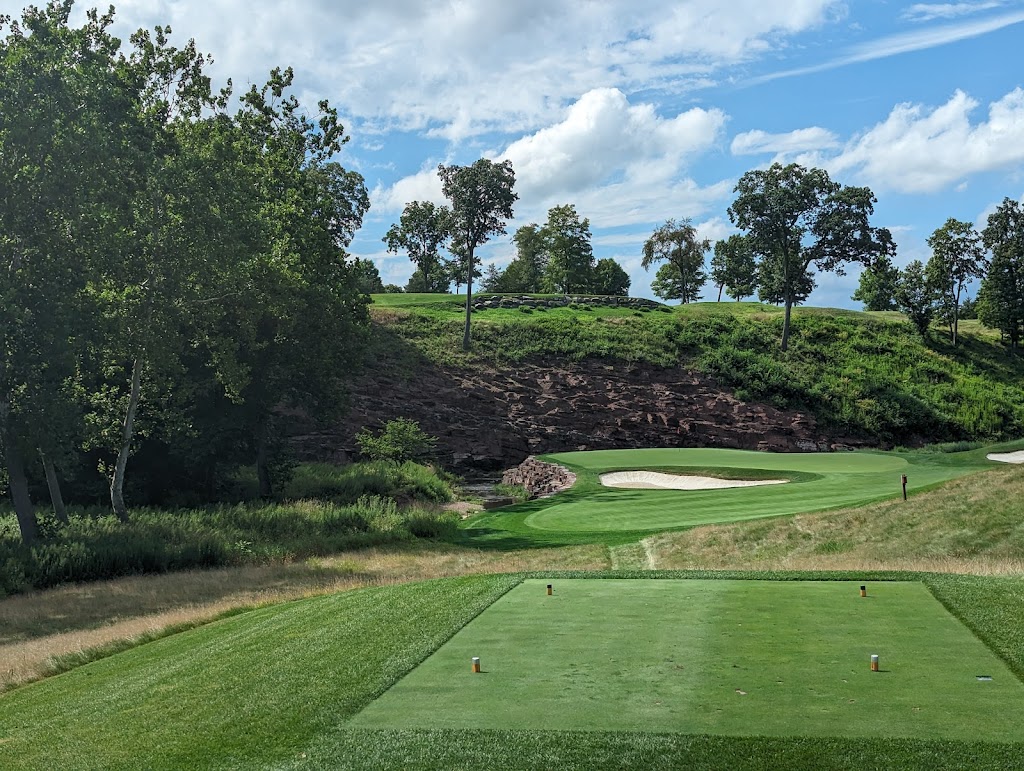 Panoramic view of a lush green golf course at The Ridge at Back Brook. Smooth