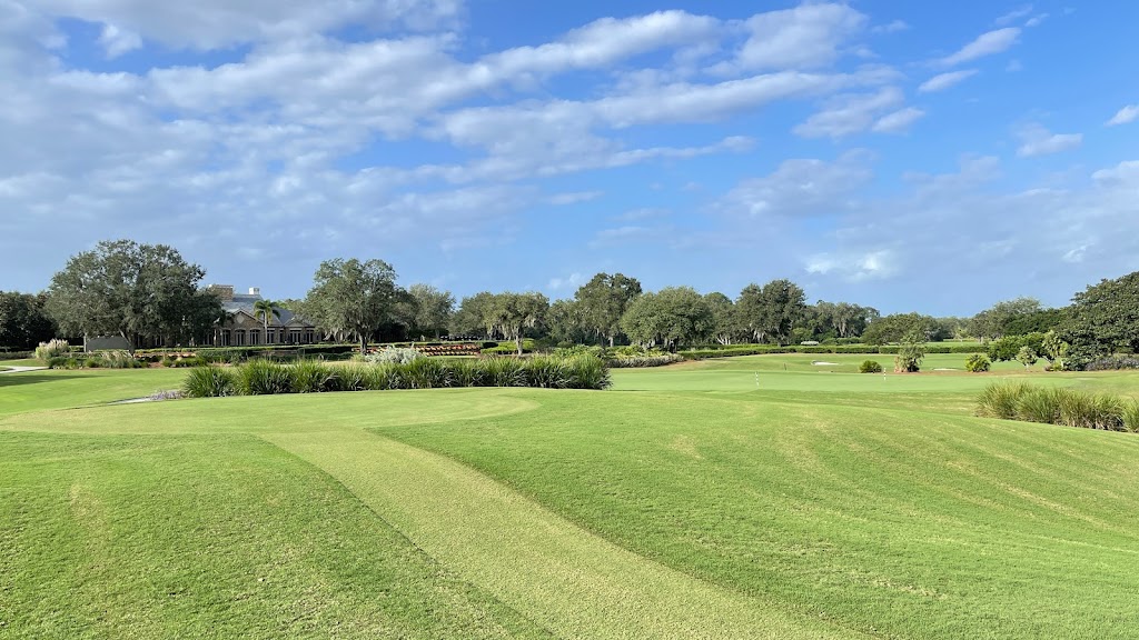 Panoramic view of a lush green golf course at The Ritz-Carlton Members Golf Club. Smooth