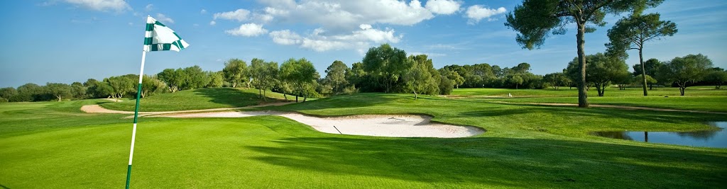 Panoramic view of a lush green golf course at The Salt Pond Golf Club. Smooth