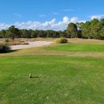 Panoramic view of a lush green golf course at Thistle Golf Club. Smooth