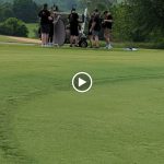 green grass with the flag in the hole.