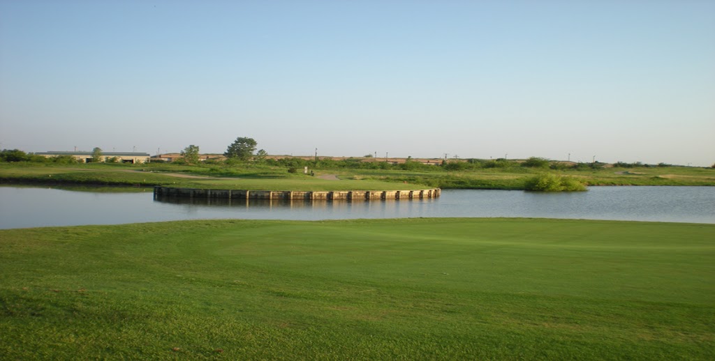 Panoramic view of a lush green golf course at Thunder Bayou Golf Links. Smooth