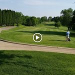 green grass with the flag in the hole.