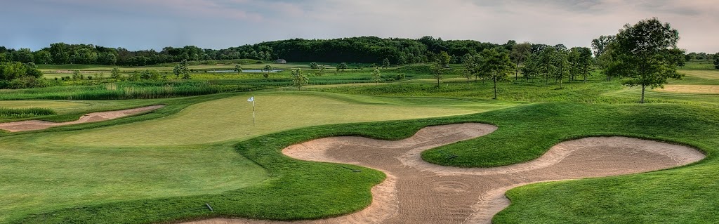 Panoramic view of a lush green golf course at Thunderhawk Golf Club. Smooth