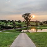 Panoramic view of a lush green golf course at Tiburon Golf Club & Banquet Facility. Smooth