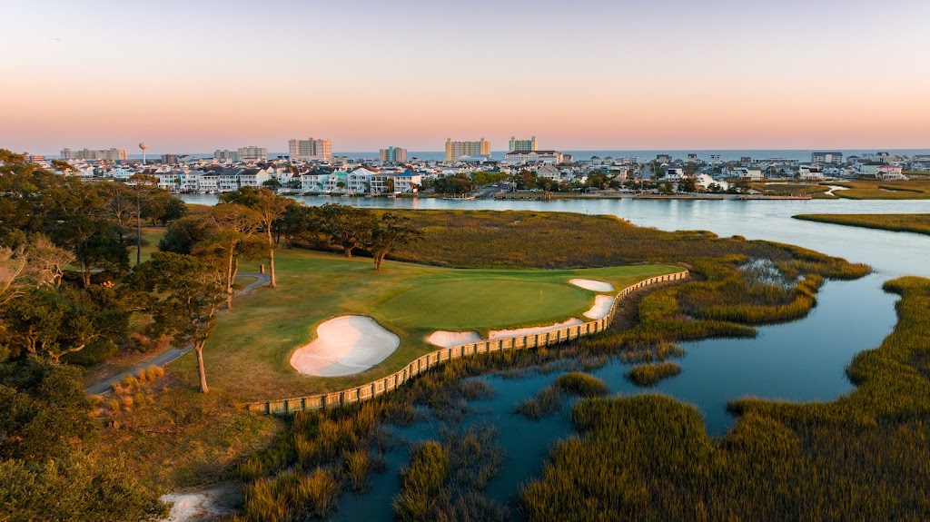 Panoramic view of a lush green golf course at Tidewater Golf Club. Smooth