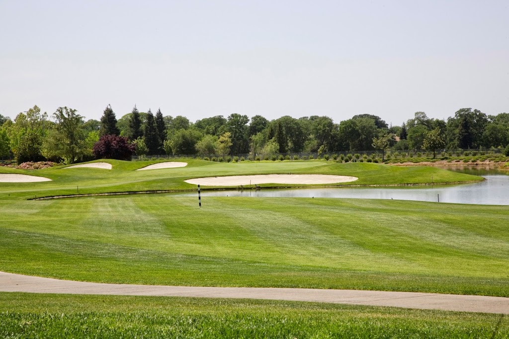 Panoramic view of a lush green golf course at Timber Creek Golf Course. Smooth
