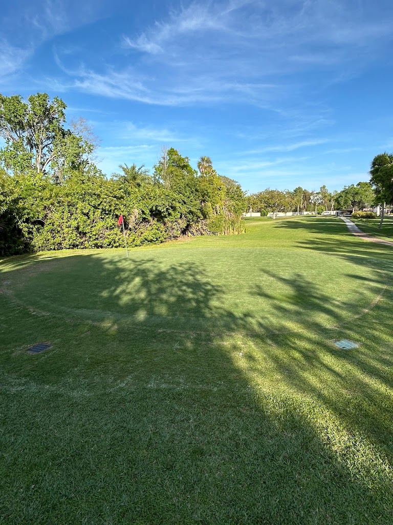 Panoramic view of a lush green golf course at Timber Creek Golf Course. Smooth