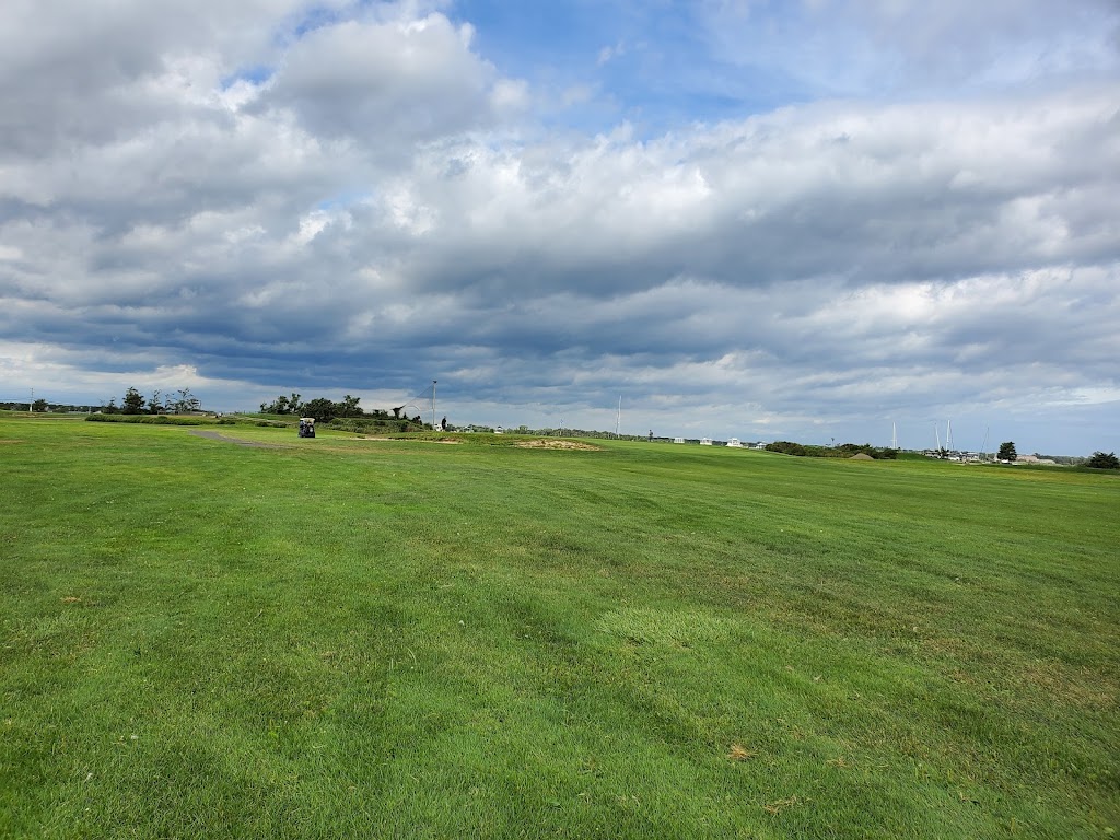 Panoramic view of a lush green golf course at Timber Point Golf Course. Smooth