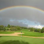 green grass with the flag in the hole.