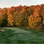 Panoramic view of a lush green golf course at Timber Wolf Golf Club. Smooth