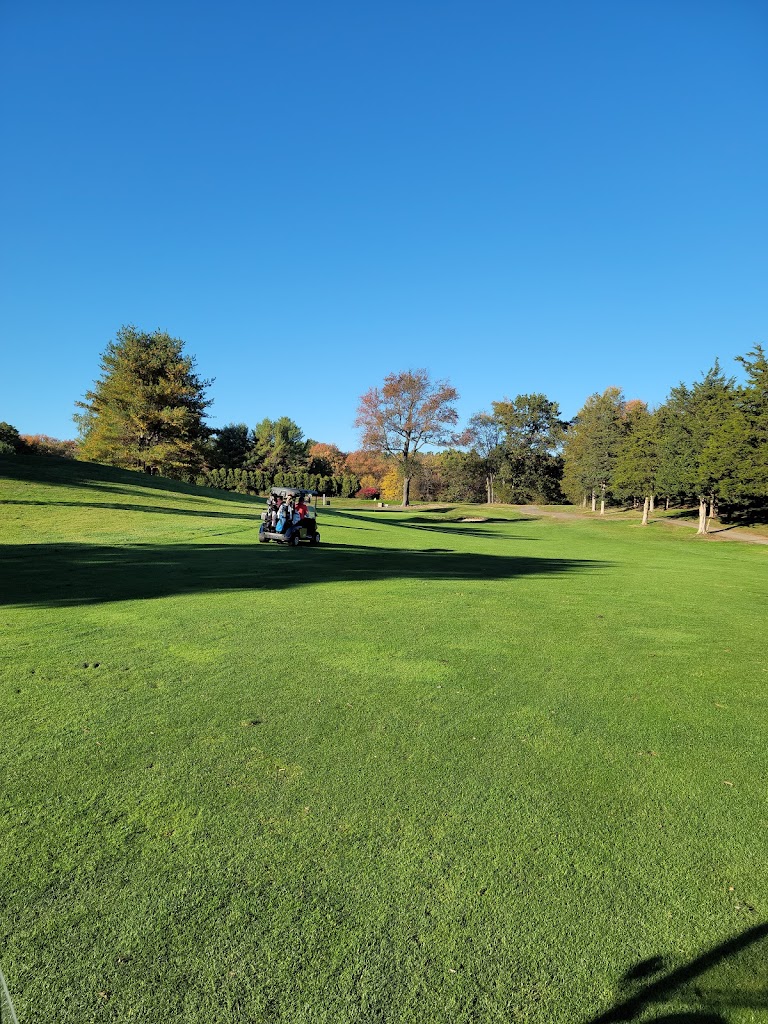 Panoramic view of a lush green golf course at Timberlin Golf Course. Smooth