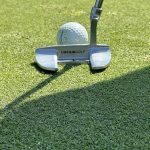 green grass with the flag in the hole.