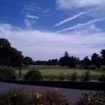 Panoramic view of a lush green golf course at Tippecanoe Country Club. Smooth