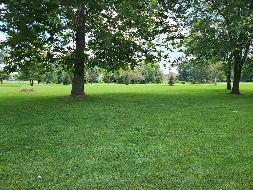 Panoramic view of a lush green golf course at Tipton Municipal Golf Course. Smooth