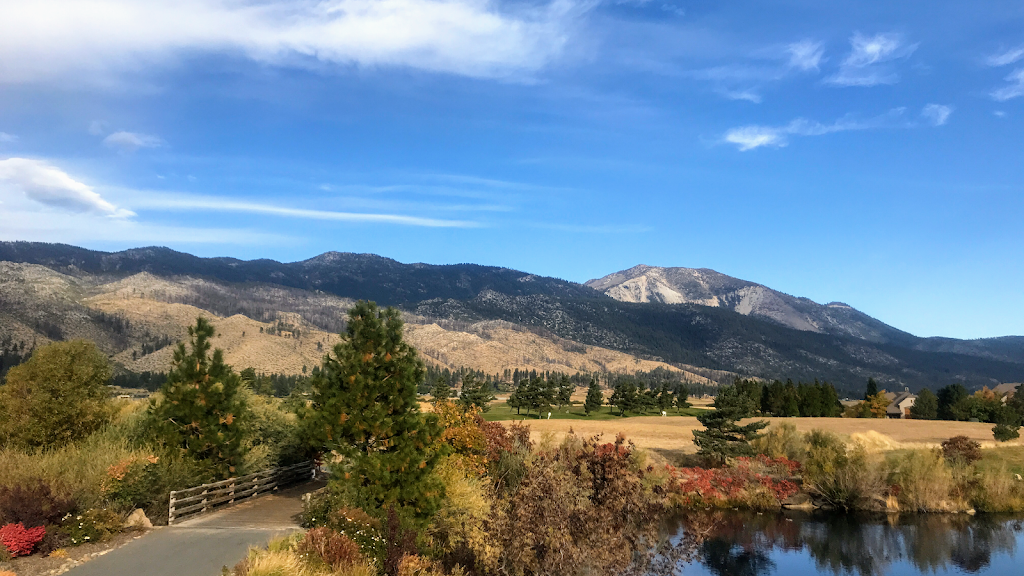 Panoramic view of a lush green golf course at Toiyabe Golf Club. Smooth