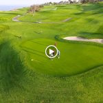 green grass with the flag in the hole.