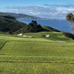 Panoramic view of a lush green golf course at Torrey Pines Golf Course. Smooth