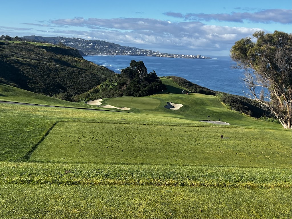 Panoramic view of a lush green golf course at Torrey Pines Golf Course. Smooth
