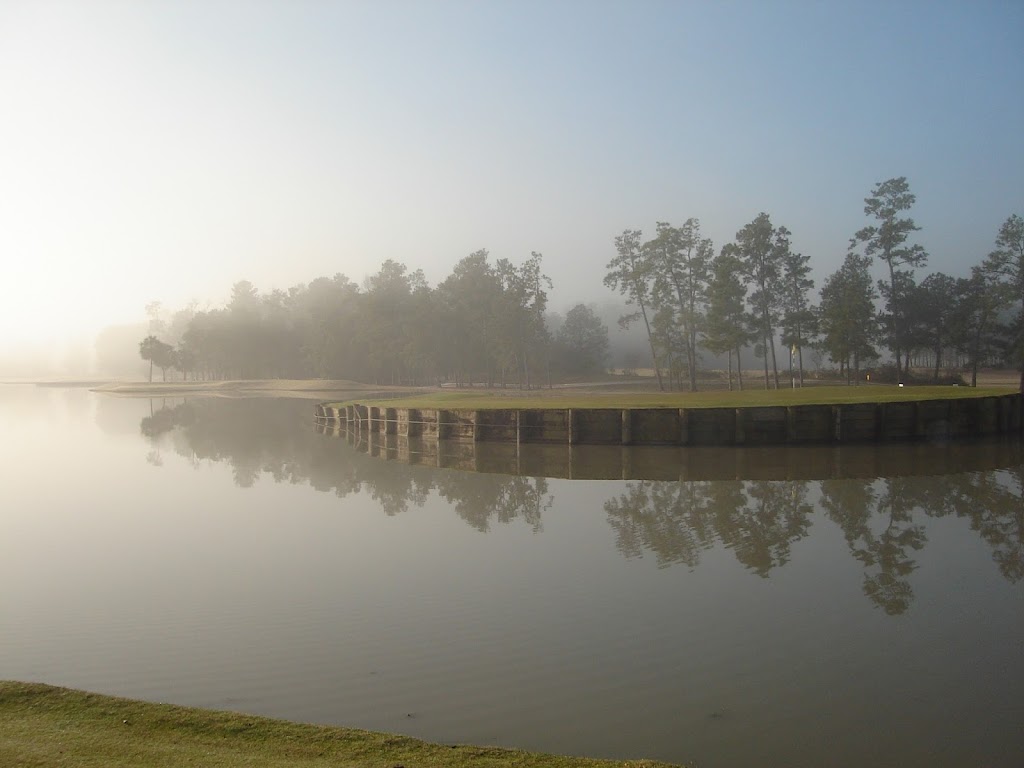 Panoramic view of a lush green golf course at Tour 18 Golf Course. Smooth