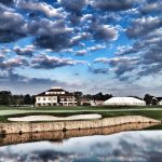 Panoramic view of a lush green golf course at Town & Country Golf Links. Smooth